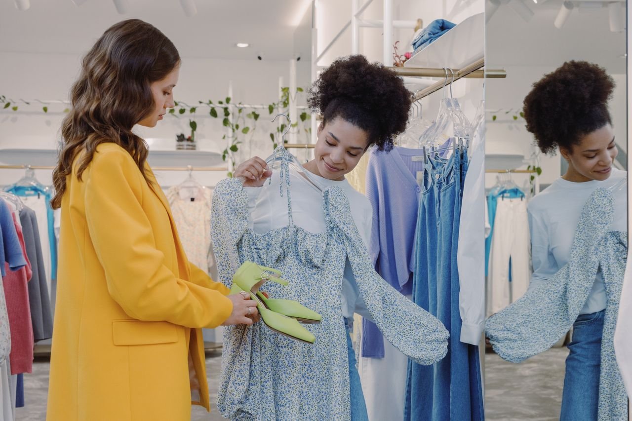services-01 Two women exploring stylish clothing in a trendy boutique. Perfect for fashion and shopping concepts.