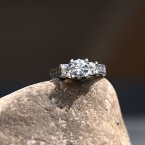 three stone oval engagement ring in platinum setting close up