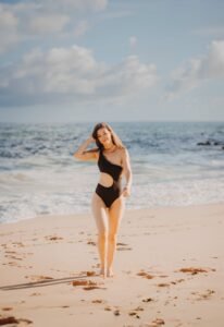 Cheeky One Piece Swimsuit: The Ultimate Guide cheeky one piece swimsuit styled with a linen coverup on the beach