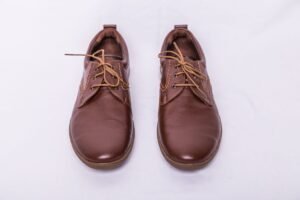 navy suit with dark brown leather oxford shoes, business setting