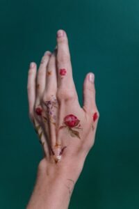 minimalist small flower line tattoo on wrist