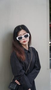 same outfit shown twice, with black rectangle sunglasses and with tortoise circle sunglasses