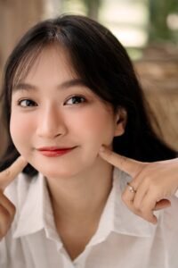woman checking collar shirt fit with two finger neck test