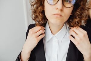 close up of a ladies collar shirt showing structured collar and button placket