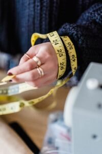 measuring tape wrapped around wrist for bracelet sizing