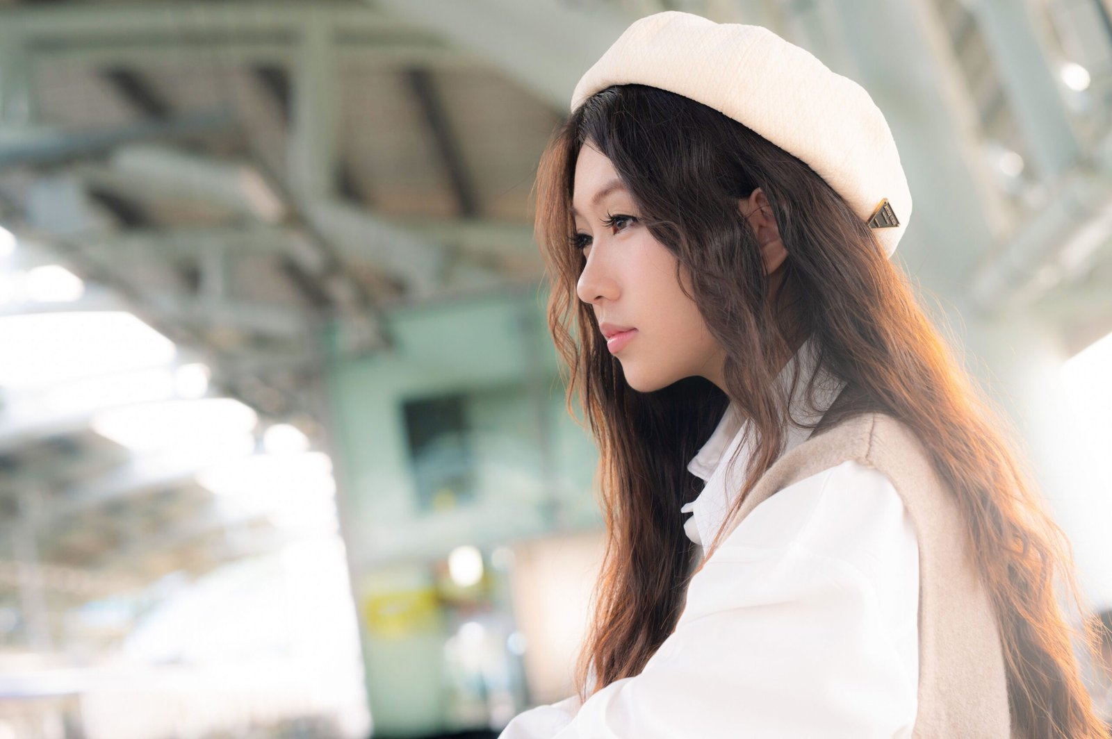 beret and Kangol bucket hat side by side on a flat surface