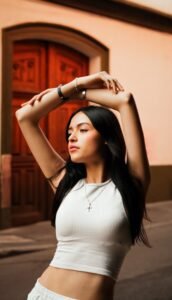 model raising arms in a thick strap tank top to show armhole coverage