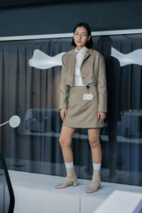 a line midi skirt office outfit with tucked blouse, blazer and loafers