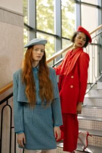  three womens beret hat colors in black, camel and burgundy laid flat on a white surface