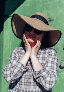 wide brim sun hat next to a wool beret to show the brim difference